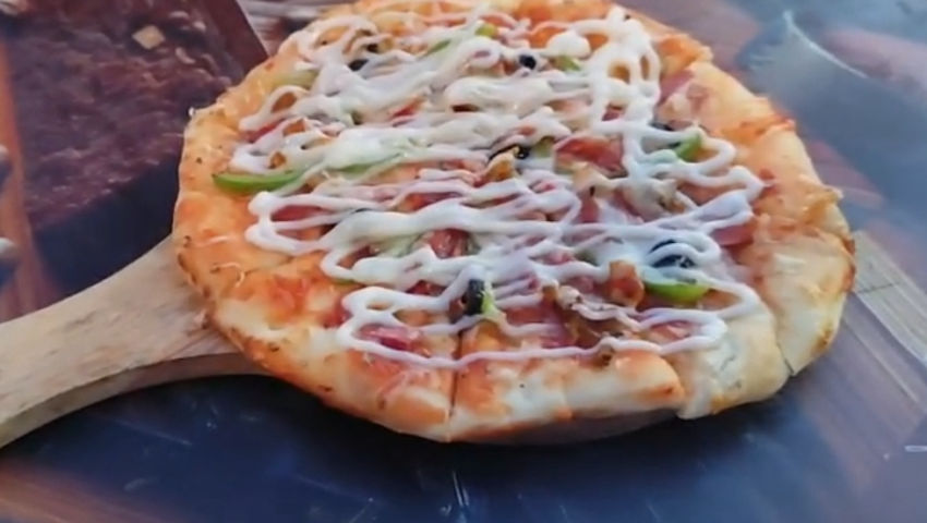 Eating pizza.